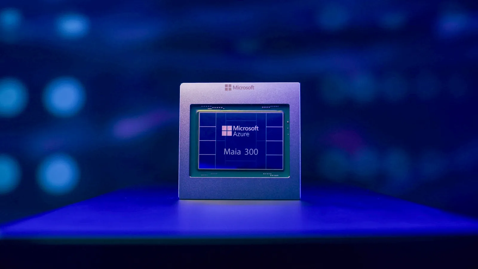 A Microsoft Azure Maia 300 chip on a blue-lit stand