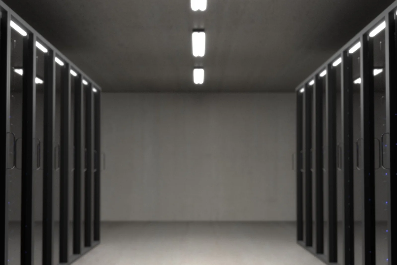 Rows of server racks in a dark data hall