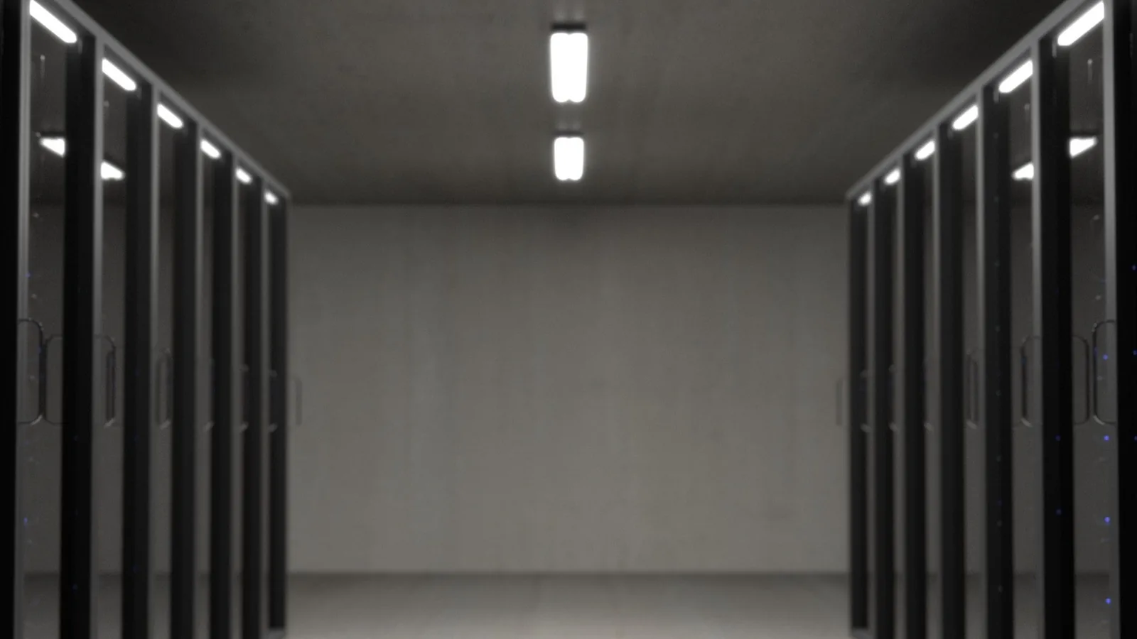 Rows of server racks in a dark data hall